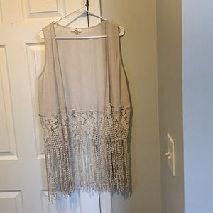 This Beige vest size small with fringes will complete your wardrobe.